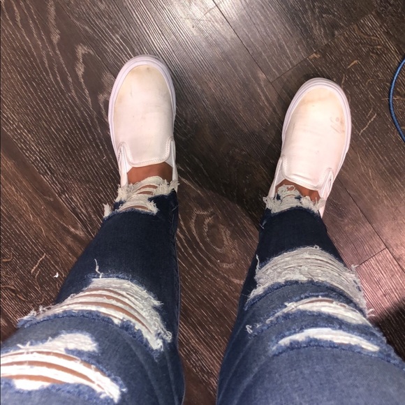 white slip on vans on feet